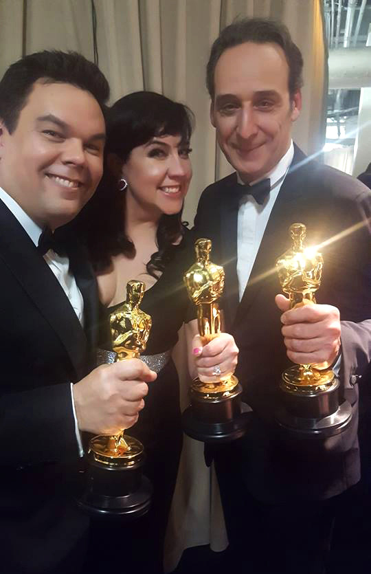 (From left) Robert Lopez, Kristen Anderson-Lopez and Alexandre Desplat backstage at the Oscars
