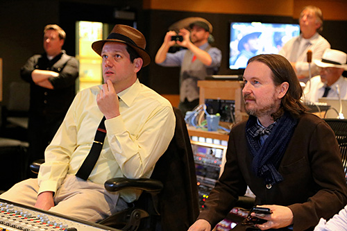 Michael Giacchino and Matt Reeves watch a playback during a recording session for \'Dawn of the Planet of the Apes\'.
