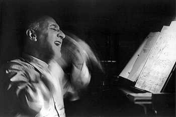 Dimitri Tiomkin rehearsing the score for \'Giant\' (Photo by Allan Grant)