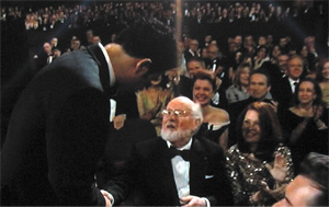 Ludovic Bource shakes hands with John Williams.