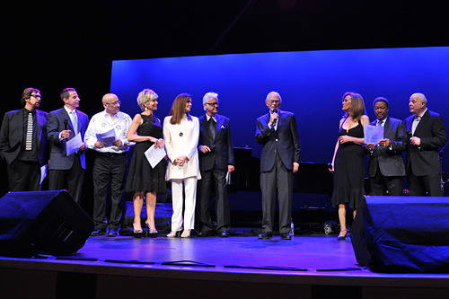 (Left to right) Stephen Bishop, Jud Friedman, Allan Rich, Debby Boone, Monica Mancini, Jack Jones, Alan Bergman, Marilyn McCoo, Billy Davis Jr. and Charles Fox in a grand finale sing-along of \'The Way We Were.\' (Photograph by Vince Bucci)